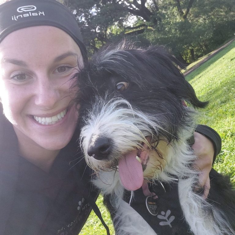 lady stroking a sheepdog